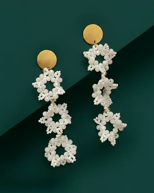White beaded Kawami Gaura earrings