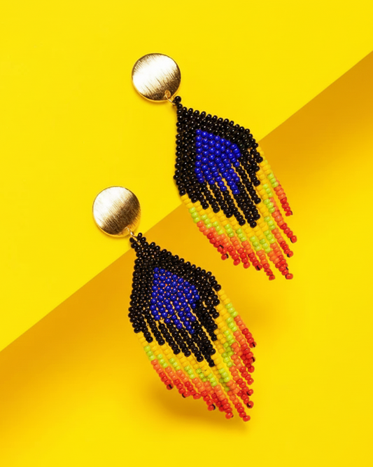 Colorful beaded Kawami earrings on a yellow background