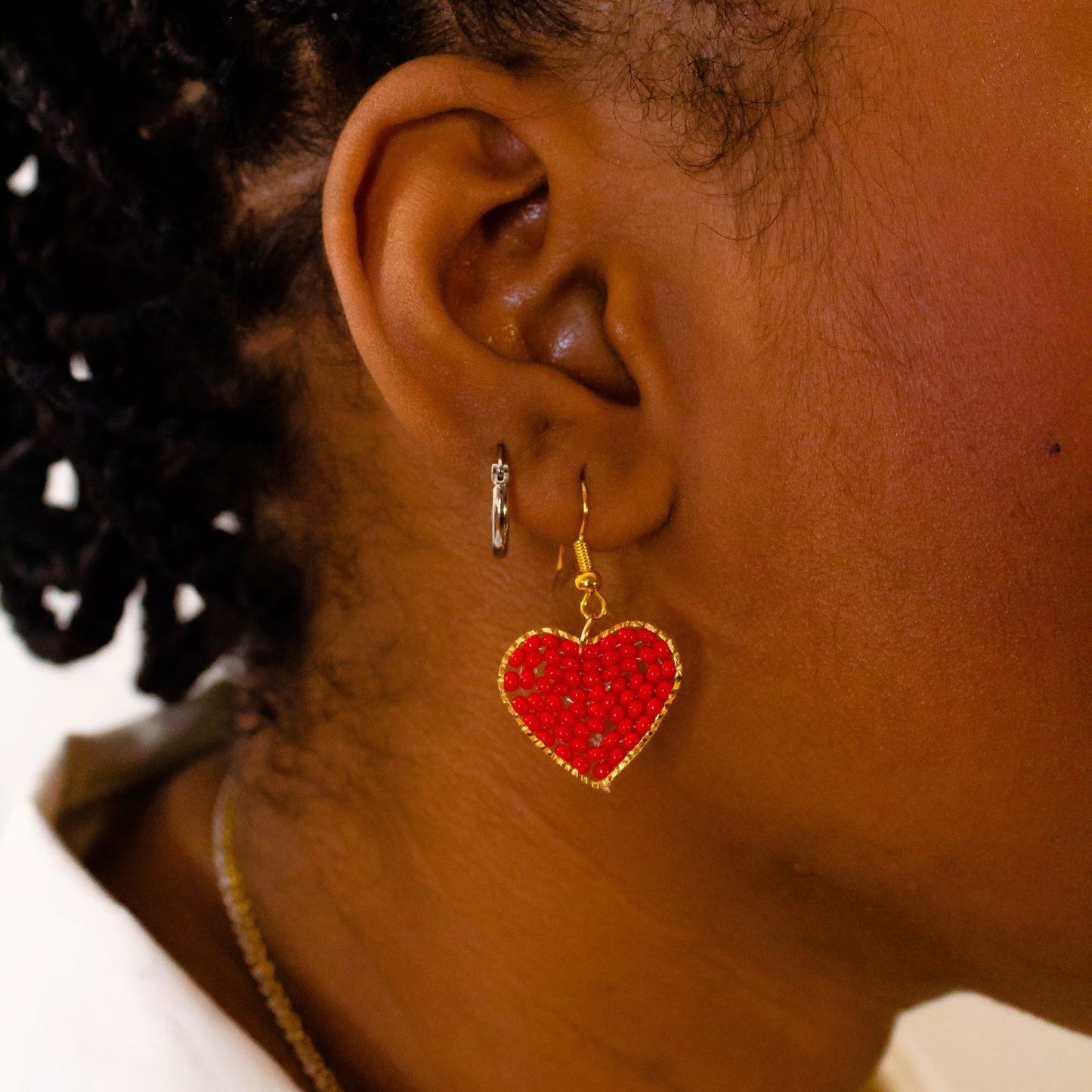 Red Heart Dangle Earrings, heart Shaped filled with glass beads. Size in width is 0.75 inches x 1.5 inches in length. Hypoallergenic, Handmade, Premier Quality, Super Lightweight. Perfect for gifts #style_earrings-only