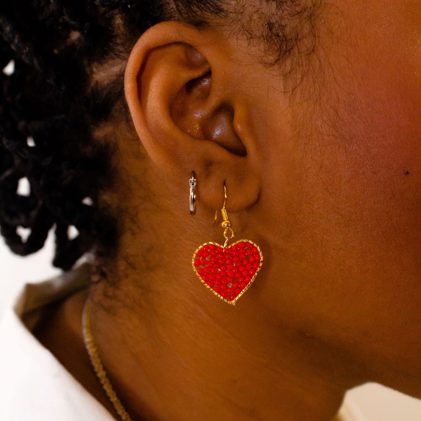 Red Heart Dangle Earrings, heart Shaped filled with glass beads. Size in width is 0.75 inches x 1.5 inches in length. Hypoallergenic, Handmade, Premier Quality, Super Lightweight. Perfect for gifts #style_earrings-only